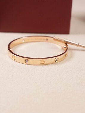 Roland Cartier Gold-Tone Bangle with Crystal Studs